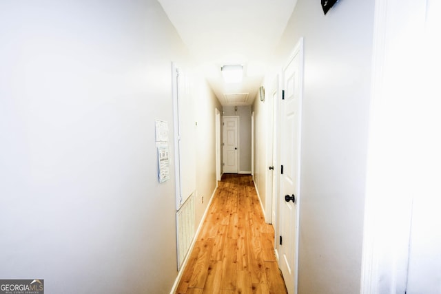 7415 Sierra Dr, Columbus, GA 31904 - hallway featuring attic access, light wood-style floors, and visible vents