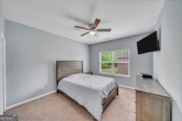 bedroom with visible vents, ceiling fan, carpet, and baseboards