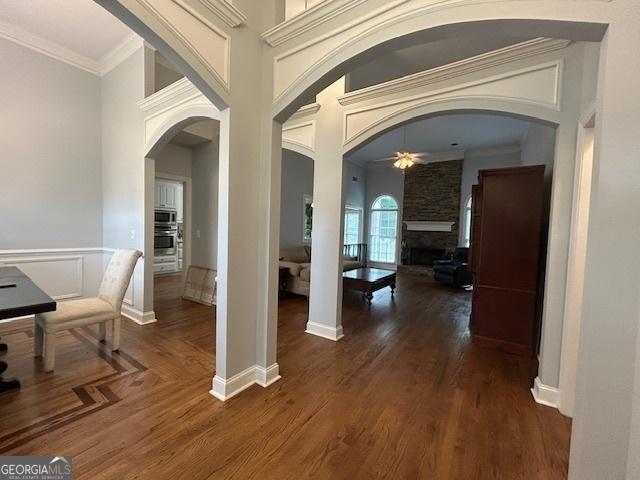 4665 Oakmont Bend Dr, Alpharetta, GA 30004 - hallway with arched walkways, wood finished floors, and ornamental molding