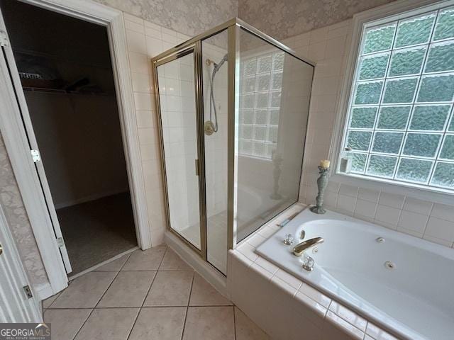 4665 Oakmont Bend Dr, Alpharetta, GA 30004 - bathroom featuring a jetted tub, a stall shower, a walk in closet, and tile patterned floors