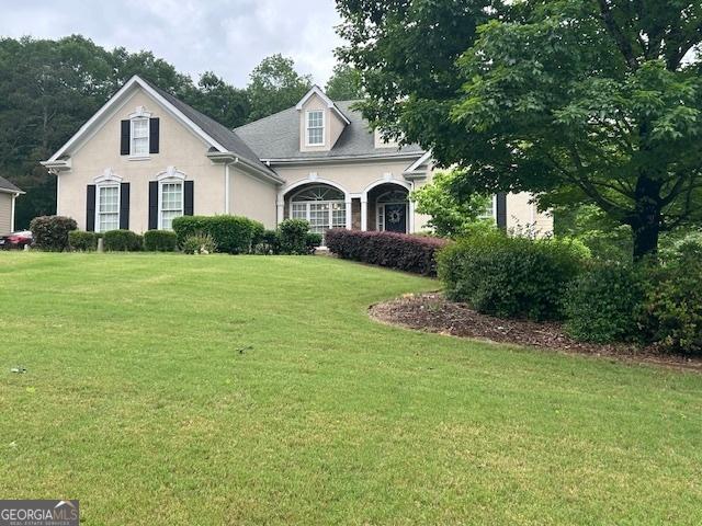 4665 Oakmont Bend Dr, Alpharetta, GA 30004 - view of front of home with a front yard and stucco siding