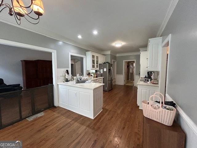 4665 Oakmont Bend Dr, Alpharetta, GA 30004 - kitchen featuring ornamental molding, freestanding refrigerator, glass insert cabinets, white cabinetry, and light countertops