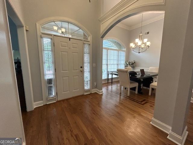 4665 Oakmont Bend Dr, Alpharetta, GA 30004 - entryway featuring a chandelier, healthy amount of natural light, wood finished floors, crown molding, and baseboards