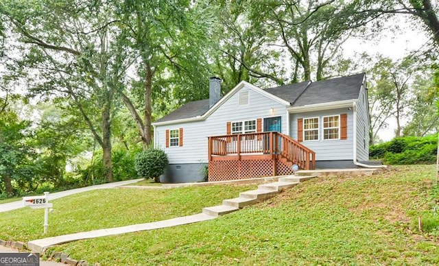 view of front of property with a chimney and a front yard