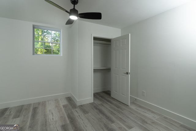 2720 Cavalier Dr, Decatur, GA 30034 - unfurnished bedroom featuring a closet, ceiling fan, baseboards, and light wood-type flooring