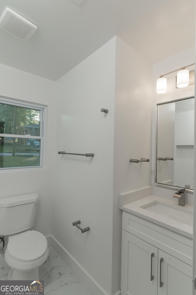 2720 Cavalier Dr, Decatur, GA 30034 - half bath with marble finish floor, toilet, vanity, baseboards, and visible vents