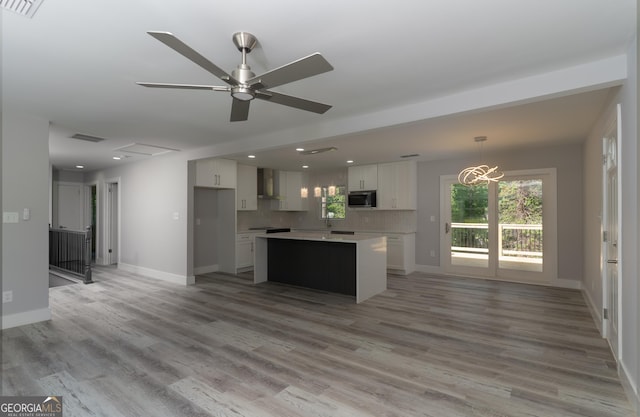 2720 Cavalier Dr, Decatur, GA 30034 - kitchen featuring open floor plan, stainless steel microwave, recessed lighting, and white cabinets