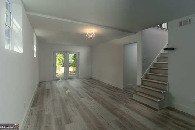 2720 Cavalier Dr, Decatur, GA 30034 - unfurnished living room featuring visible vents, stairway, wood finished floors, and baseboards