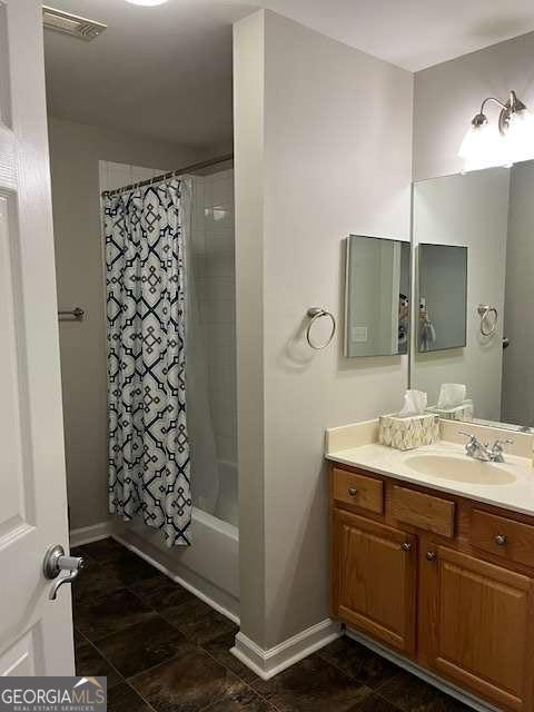 220 Rehobeth Way, Fayetteville, GA 30214 - bathroom with visible vents, baseboards, shower / bath combo, and vanity
