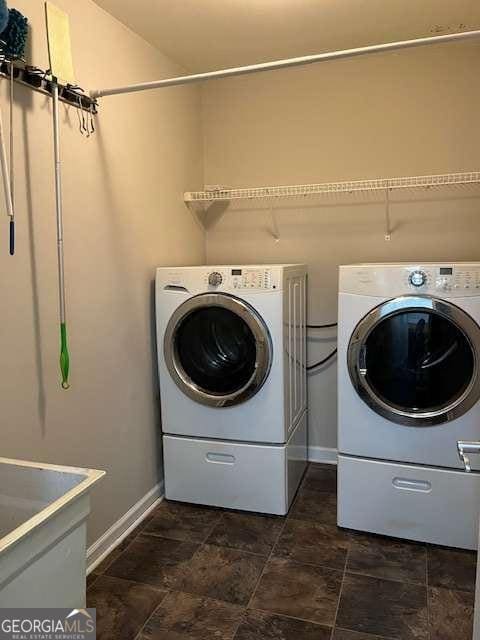 220 Rehobeth Way, Fayetteville, GA 30214 - laundry room with laundry area, stone finish flooring, baseboards, and washer and dryer