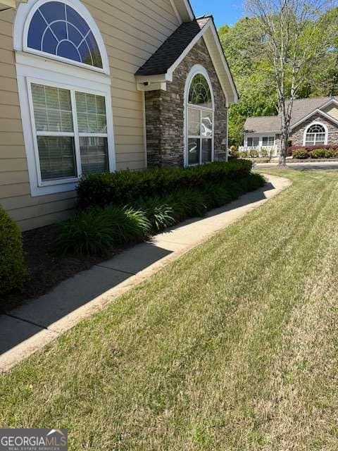 220 Rehobeth Way, Fayetteville, GA 30214 - property entrance with a lawn