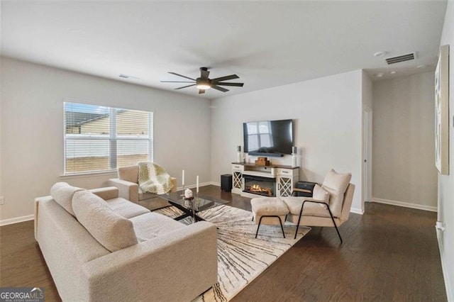 340 Paulownia Cir, Mcdonough, GA 30253 - living area with a wealth of natural light, visible vents, ceiling fan, and baseboards