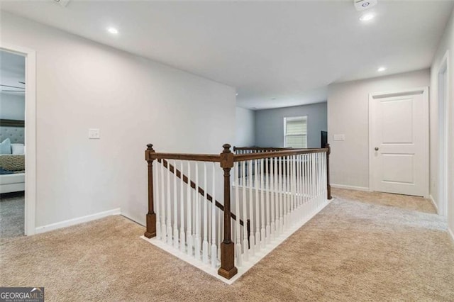 340 Paulownia Cir, Mcdonough, GA 30253 - hallway with baseboards, recessed lighting, carpet floors, and an upstairs landing