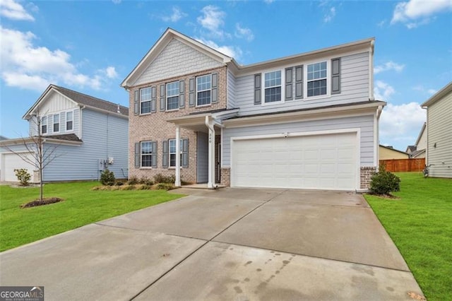 340 Paulownia Cir, Mcdonough, GA 30253 - traditional-style house featuring a garage, brick siding, a front lawn, and driveway