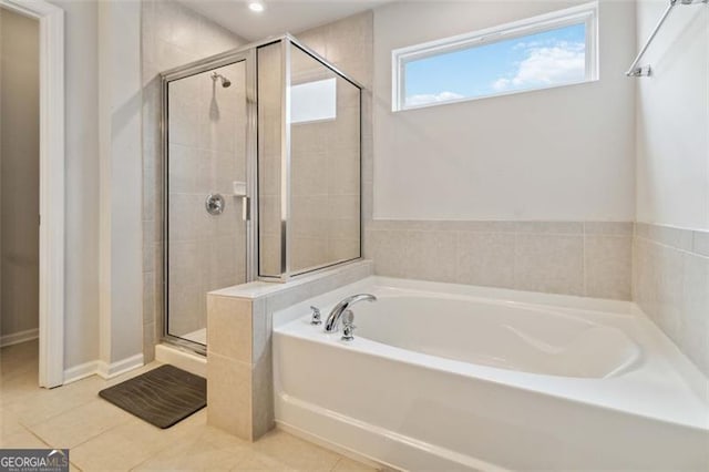 340 Paulownia Cir, Mcdonough, GA 30253 - full bathroom with tile patterned floors, a garden tub, a shower stall, and recessed lighting