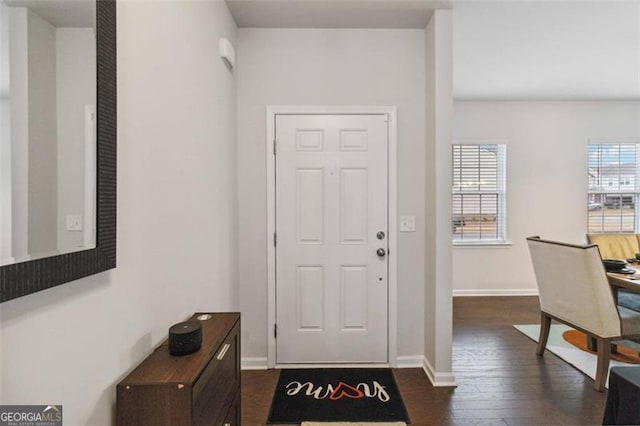340 Paulownia Cir, Mcdonough, GA 30253 - foyer with baseboards and dark wood-style flooring