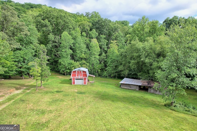 266 Ritchie Rd, Tiger, GA 30576 - view of yard featuring an outdoor structure, a pole building, and a view of trees
