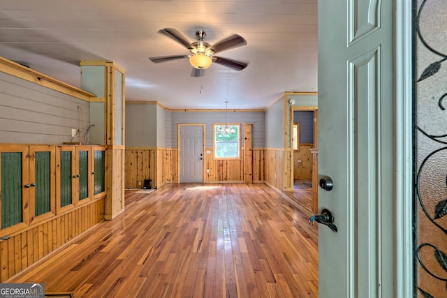 266 Ritchie Rd, Tiger, GA 30576 - interior space with wainscoting, hardwood / wood-style flooring, a ceiling fan, and wooden walls
