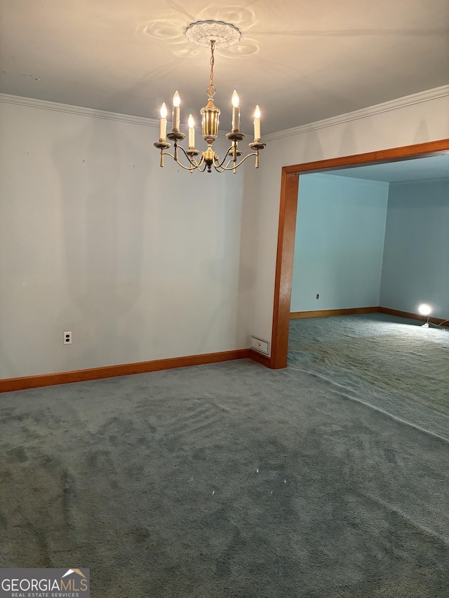 empty room with ornamental molding, carpet flooring, a chandelier, and baseboards