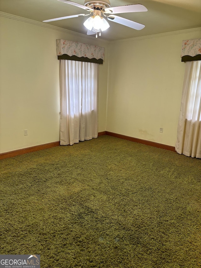 unfurnished room featuring crown molding, ceiling fan, carpet floors, and baseboards