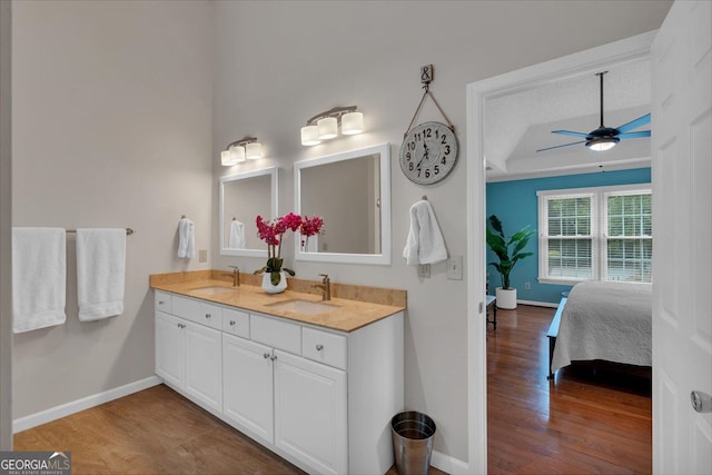 bathroom featuring a sink, ceiling fan, and wood finished floors