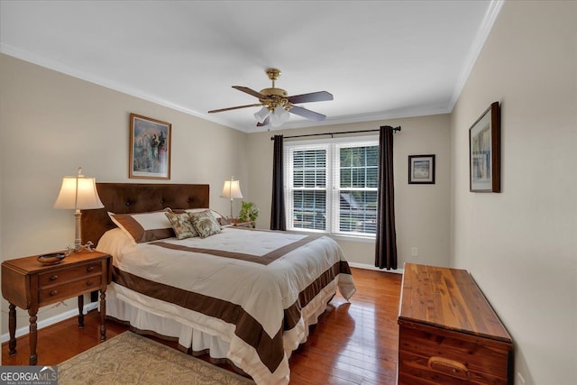 bedroom with baseboards, ornamental molding, hardwood / wood-style flooring, and ceiling fan