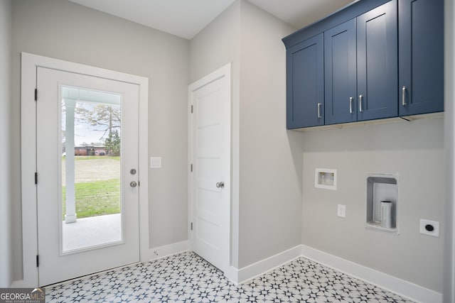 laundry room featuring hookup for an electric dryer, washer hookup, baseboards, cabinet space, and light floors
