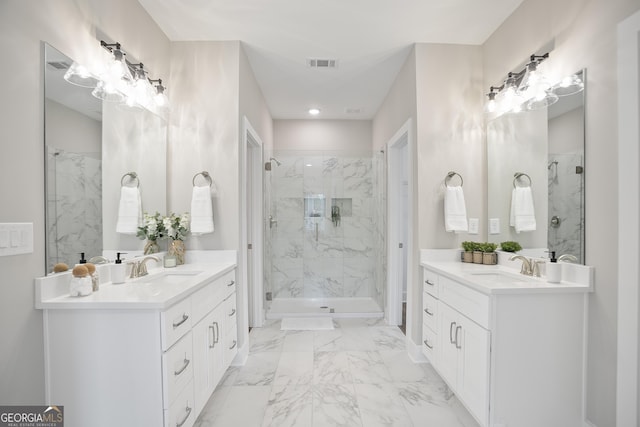 bathroom with two vanities, visible vents, and a marble finish shower