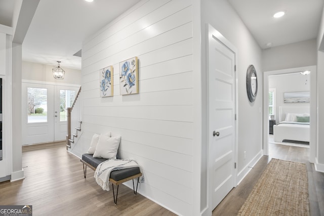 corridor featuring recessed lighting, wood finished floors, and plenty of natural light