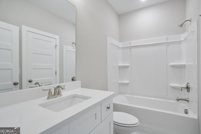 bathroom with toilet, vanity, and shower / bathing tub combination