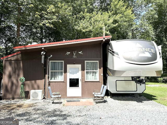 view of front of property with ac unit