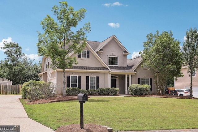 traditional-style house featuring stucco siding and a shingled roof