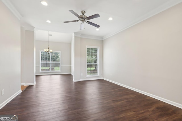 spare room with a chandelier, ornamental molding, baseboards, dark wood-style flooring, and recessed lighting