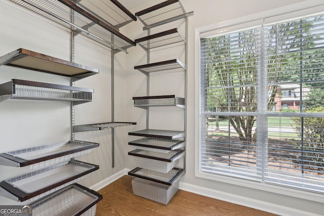 spacious closet with wood finished floors
