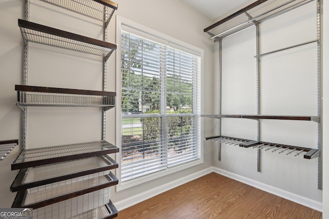 spacious closet with wood finished floors