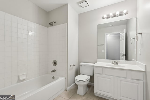bathroom with shower / washtub combination, tile patterned flooring, toilet, and vanity