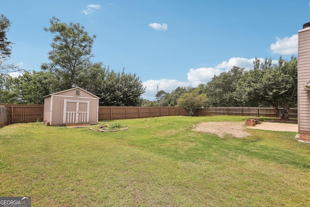 view of yard featuring a storage shed, an outbuilding, and a patio