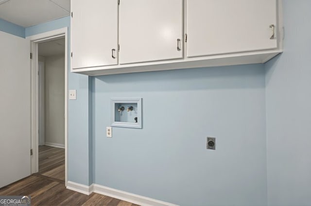 clothes washing area with electric dryer hookup, baseboards, hookup for a washing machine, cabinet space, and dark wood-type flooring
