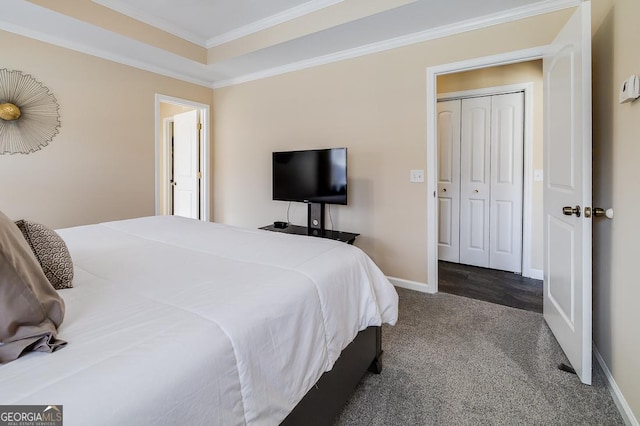 carpeted bedroom featuring crown molding and baseboards