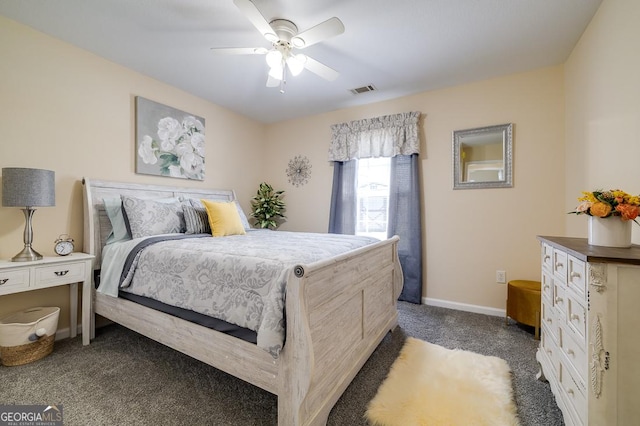 bedroom with dark carpet, visible vents, a ceiling fan, and baseboards