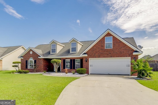 traditional-style house with brick siding, driveway, an attached garage, and a front yard