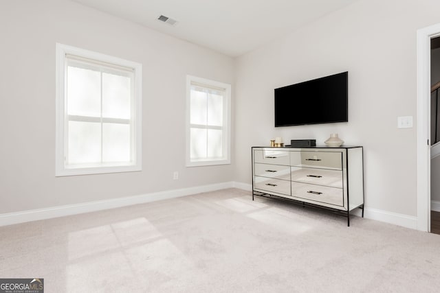 bedroom with carpet flooring, visible vents, and baseboards