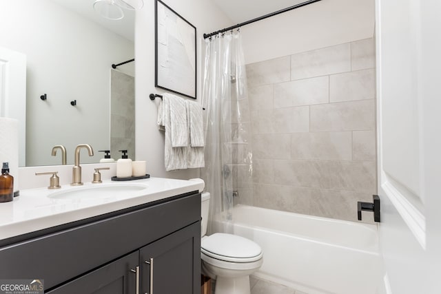full bathroom with shower / tub combo, toilet, and vanity