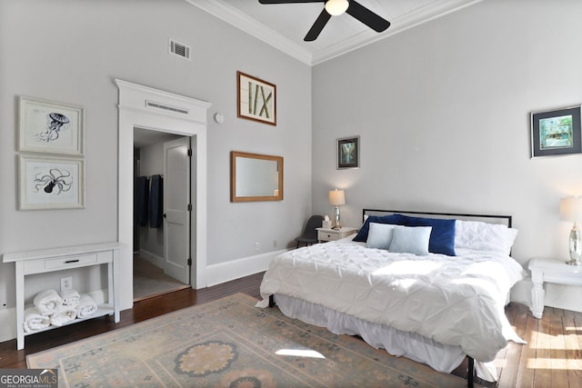 110 Barnard St, Savannah, GA 31401 - bedroom featuring baseboards, visible vents, wood finished floors, and crown molding