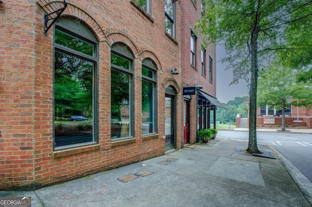 exterior space with brick siding
