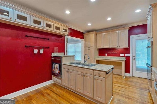 kitchen featuring recessed lighting, glass insert cabinets, baseboards, light wood-style flooring, and light countertops
