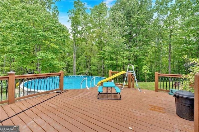 wooden deck featuring an outdoor pool