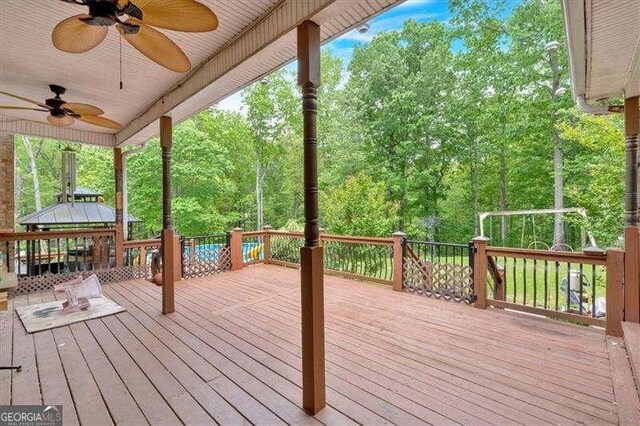 wooden deck featuring a gazebo and a ceiling fan