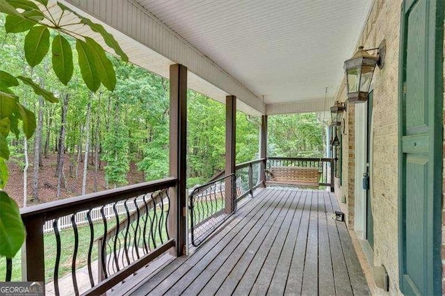 wooden deck featuring covered porch