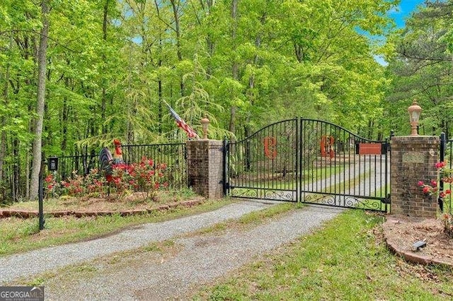 view of gate with fence